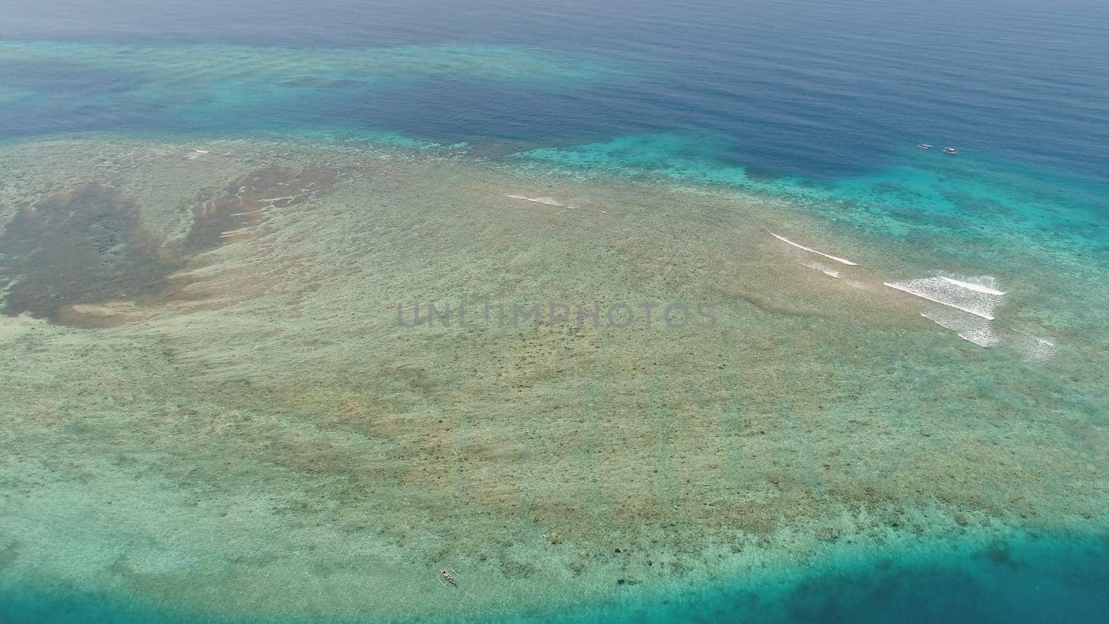 seascape aerial view coral reef, atoll with turquoise water in sea.Tropical atoll, coral reef in ocean waters. Travel concept.