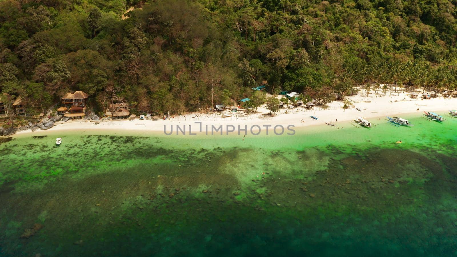 Tropical beach and clear blue water. El nido, Philippines, Palawan. Seascape with tropical rocky islands, ocean blue water. Summer and travel vacation concept