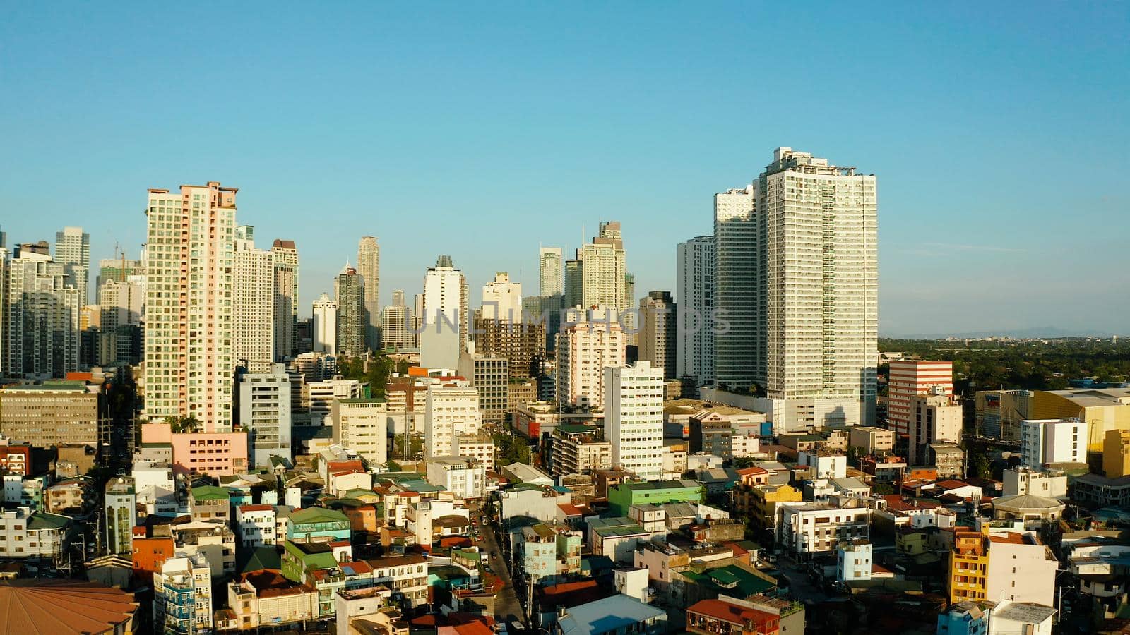 Populous city of Manila, the capital of the Philippines with skyscrapers, streets and buildings. Travel vacation concept.