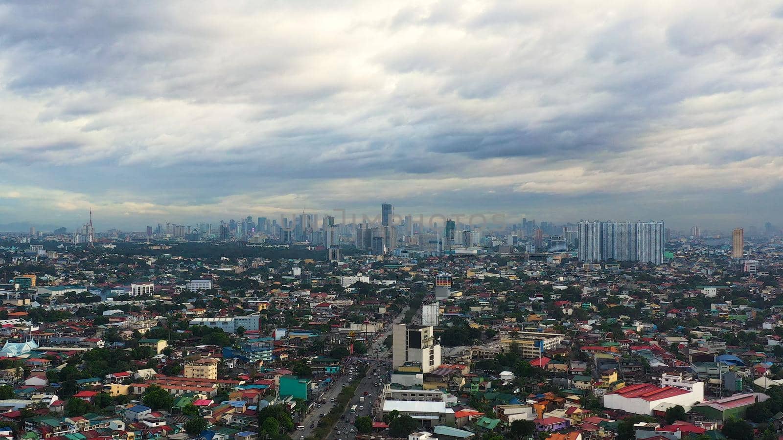 Manila city with skyscrapers, modern buildings and Makati business center, aerial drone. Travel vacation concept.