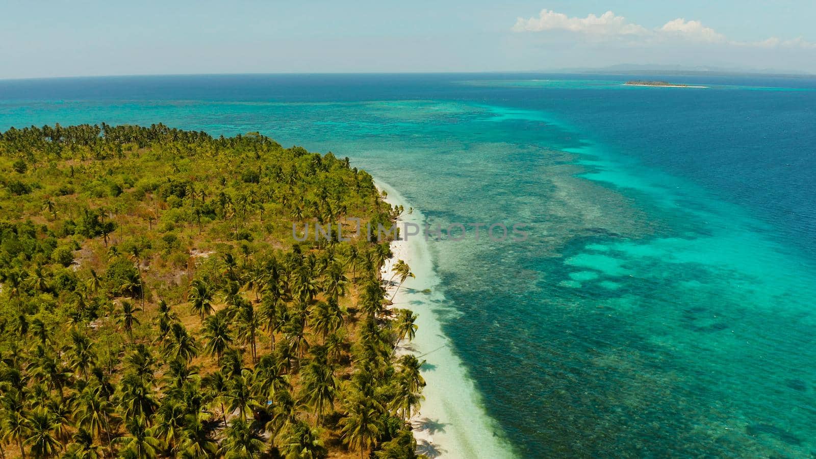 Sandy beach and tropical islands by atoll with coral reef, top view. Patongong Island with sandy beach. Summer and travel vacation concept.