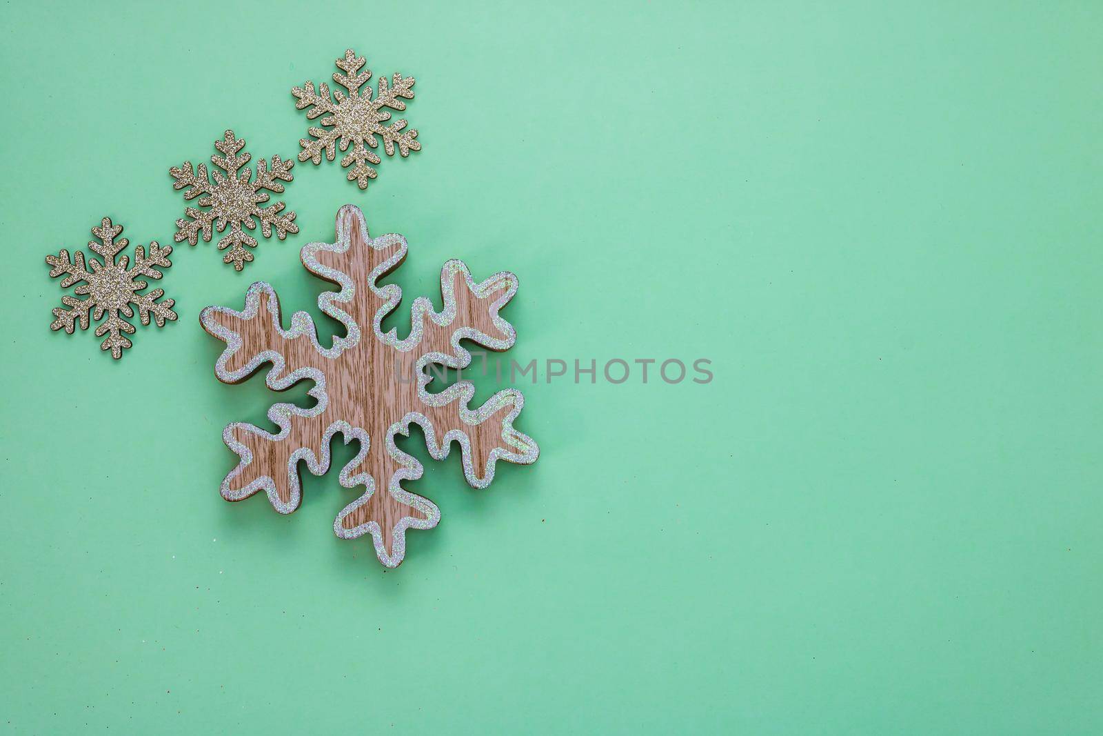 Glittery snowflakes decorations in a Christmas composition. Top view with copy space for december season