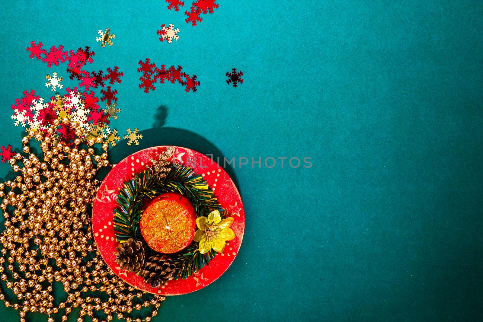 December season composition, top view with copy space on green background. Christmas composition with ornaments and decorations.   by vladispas