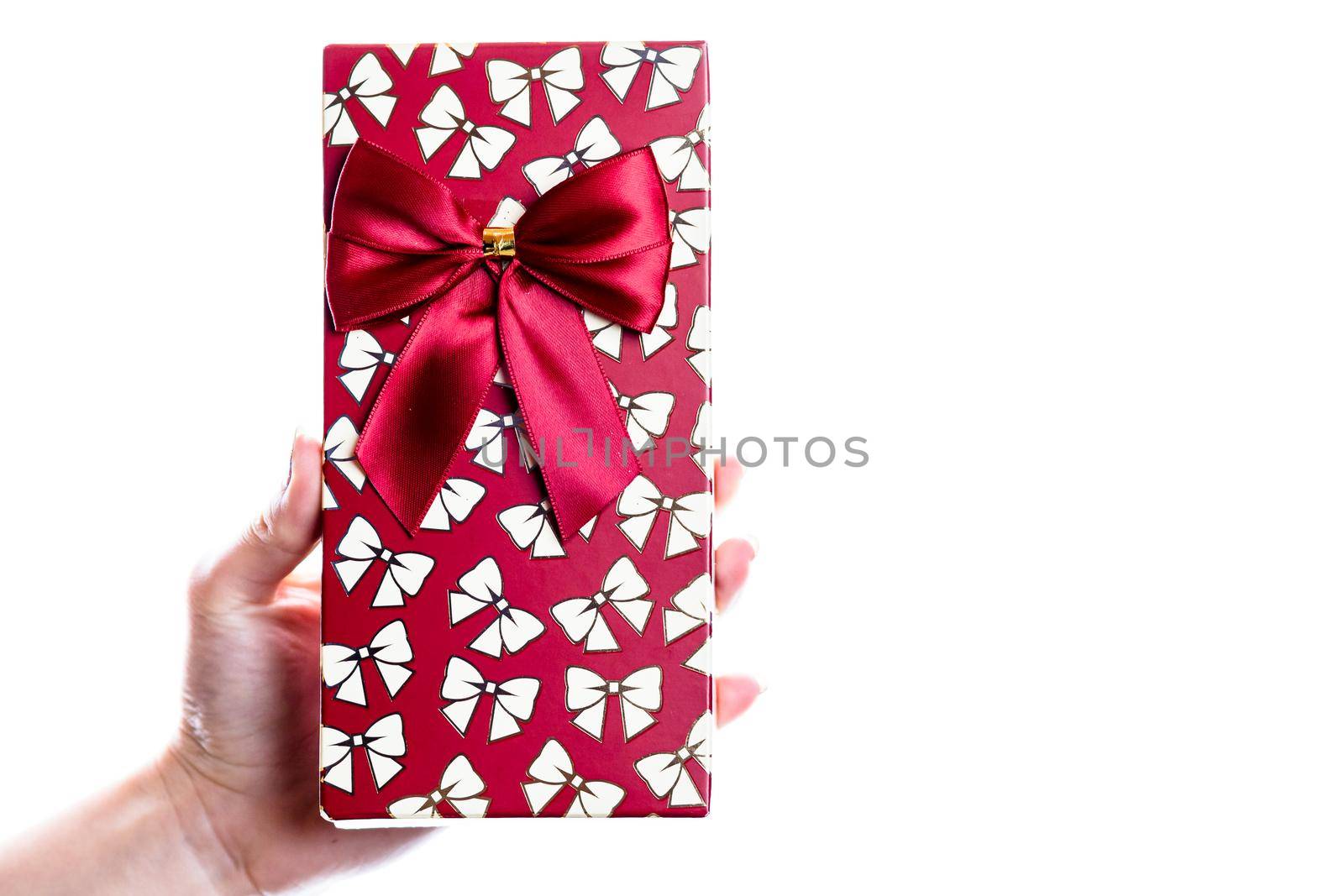 Hand showing holding giving or receiving gift present box isolated on white background. by vladispas