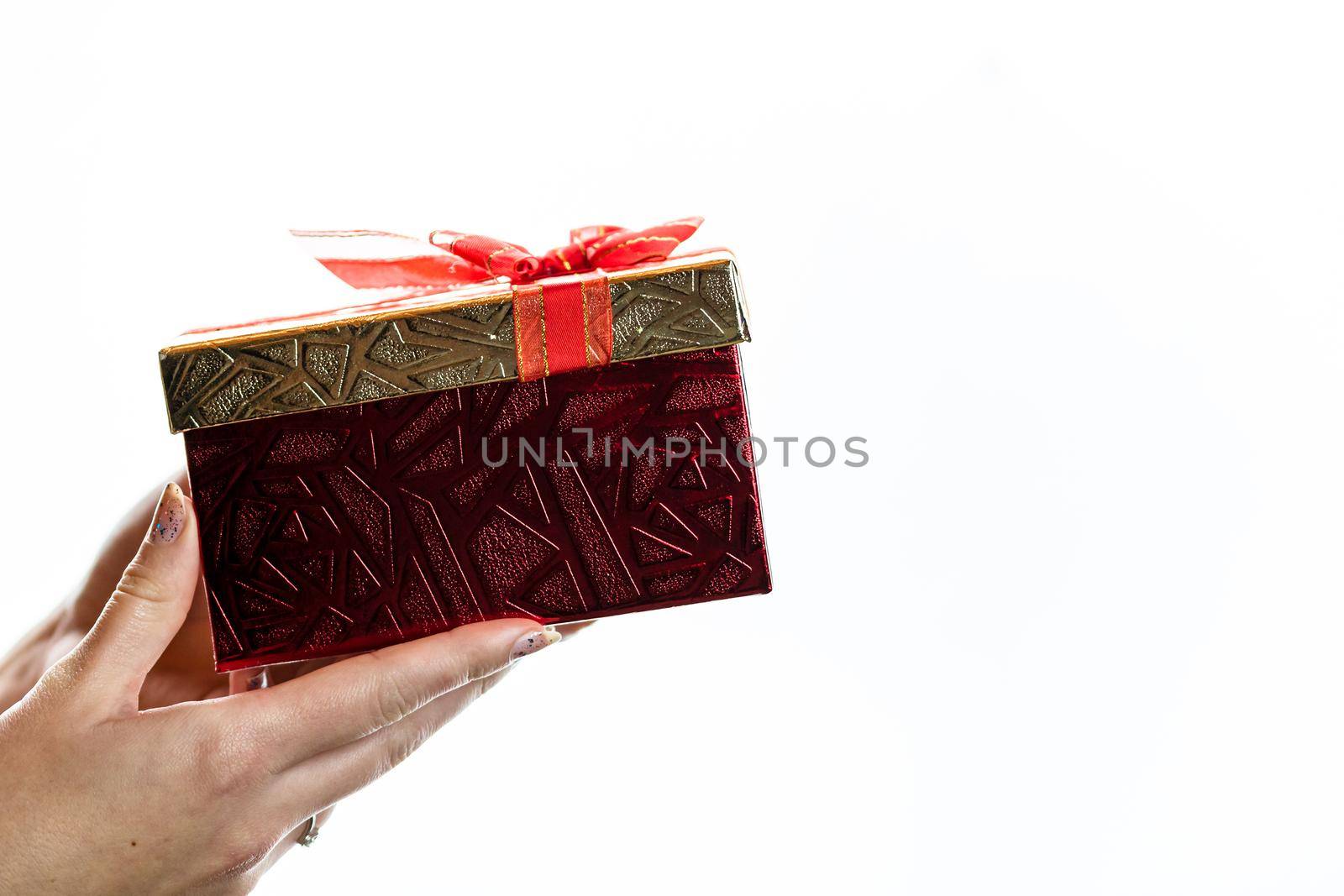 Hand showing holding giving or receiving gift present box isolated on white background.