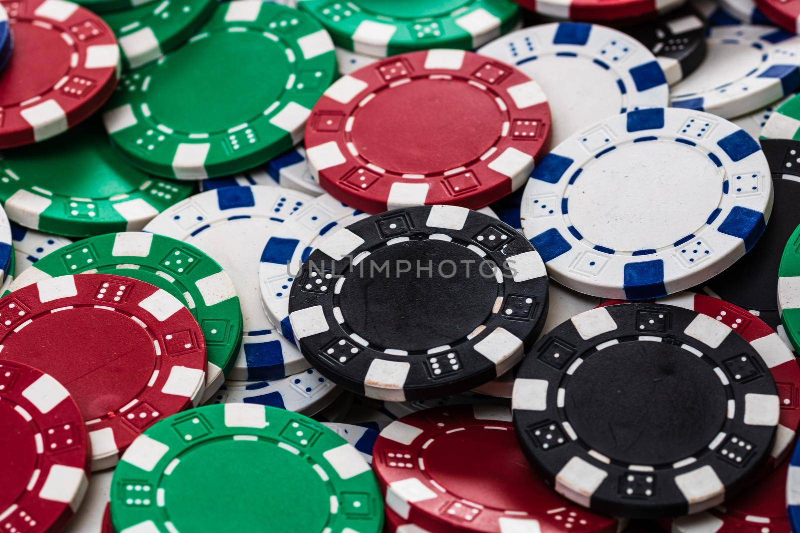 Poker chips close up background. Casino concept, risk, chance, good luck or gambling. Detail of casino chips