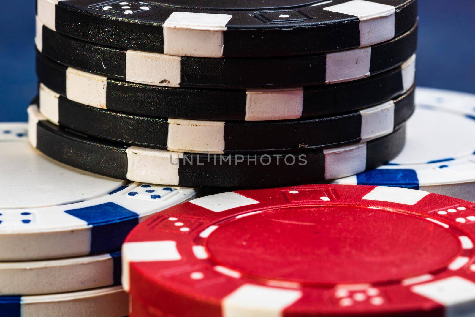 Poker game concept. Casino concept for business, risk,chance, good luck or gambling. Stack of Poker chips, close up, isolated. by vladispas