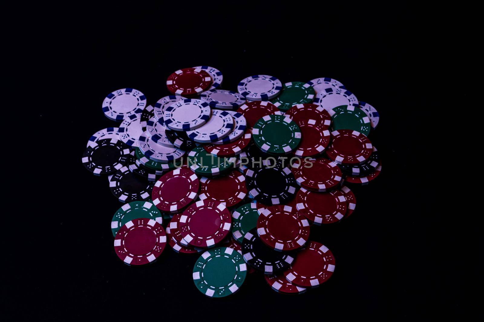 Mix of poker chips on black background by vladispas