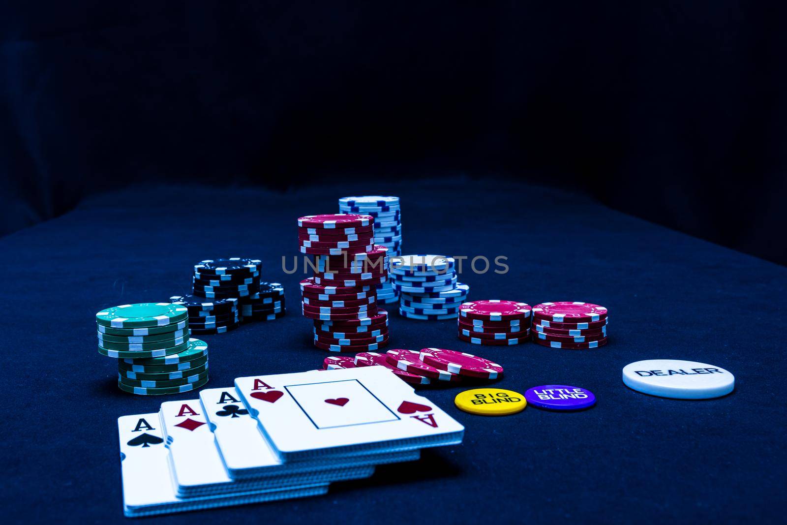 Stack of poker chips and poker cards on black background by vladispas