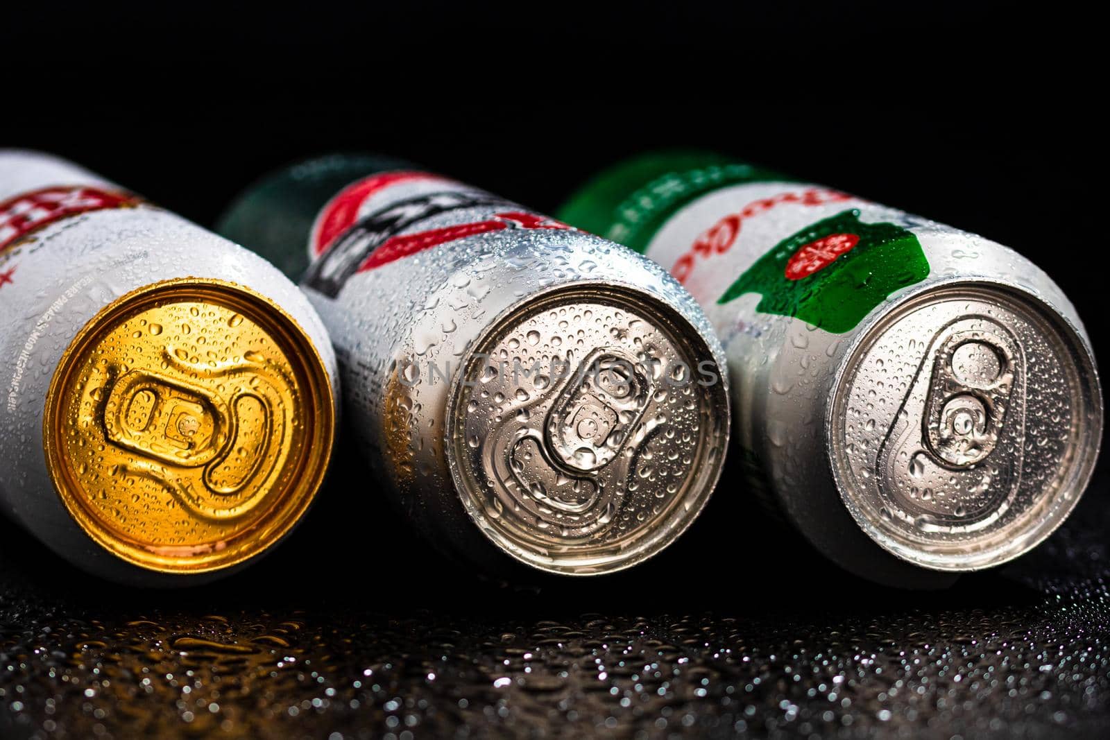 Condensation water droplets on beer cans isolated on black. Bucharest, Romania, 2020