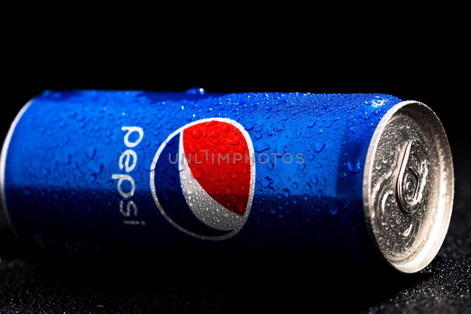 Editorial photo of Pepsi can with water droplets on black background. Studio shot in Bucharest, Romania, 2021