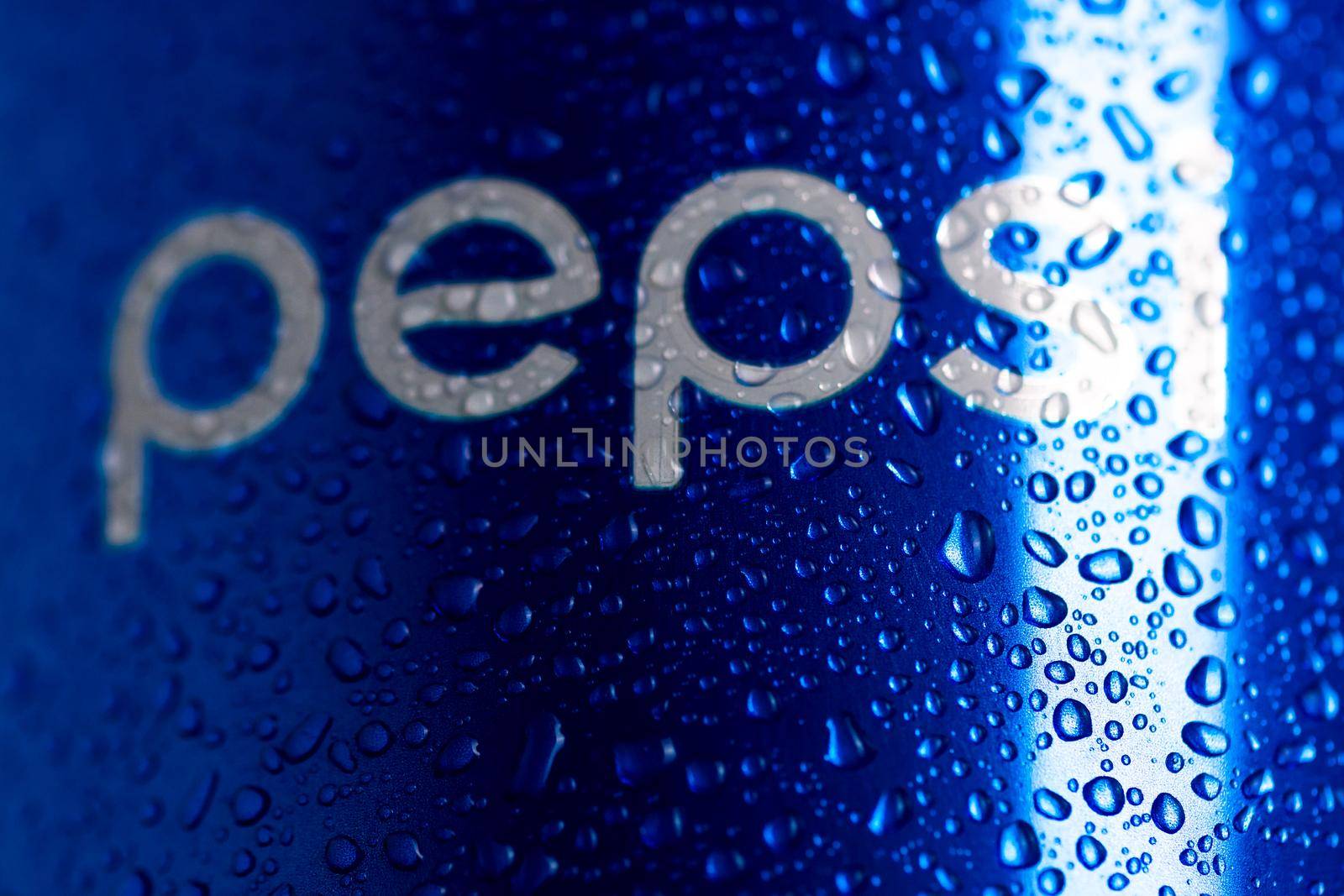 Detail of classic Pepsi can with water droplets on black background. Studio shot in Bucharest, Romania, 2021
