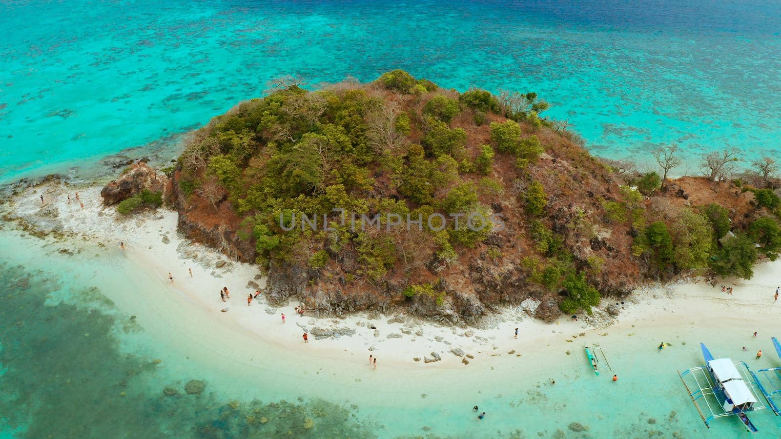 aerial view tropical island with sand white beach. Bulog Dos, Philippines, Palawan. Seascape bay with turquoise water and coral reef.