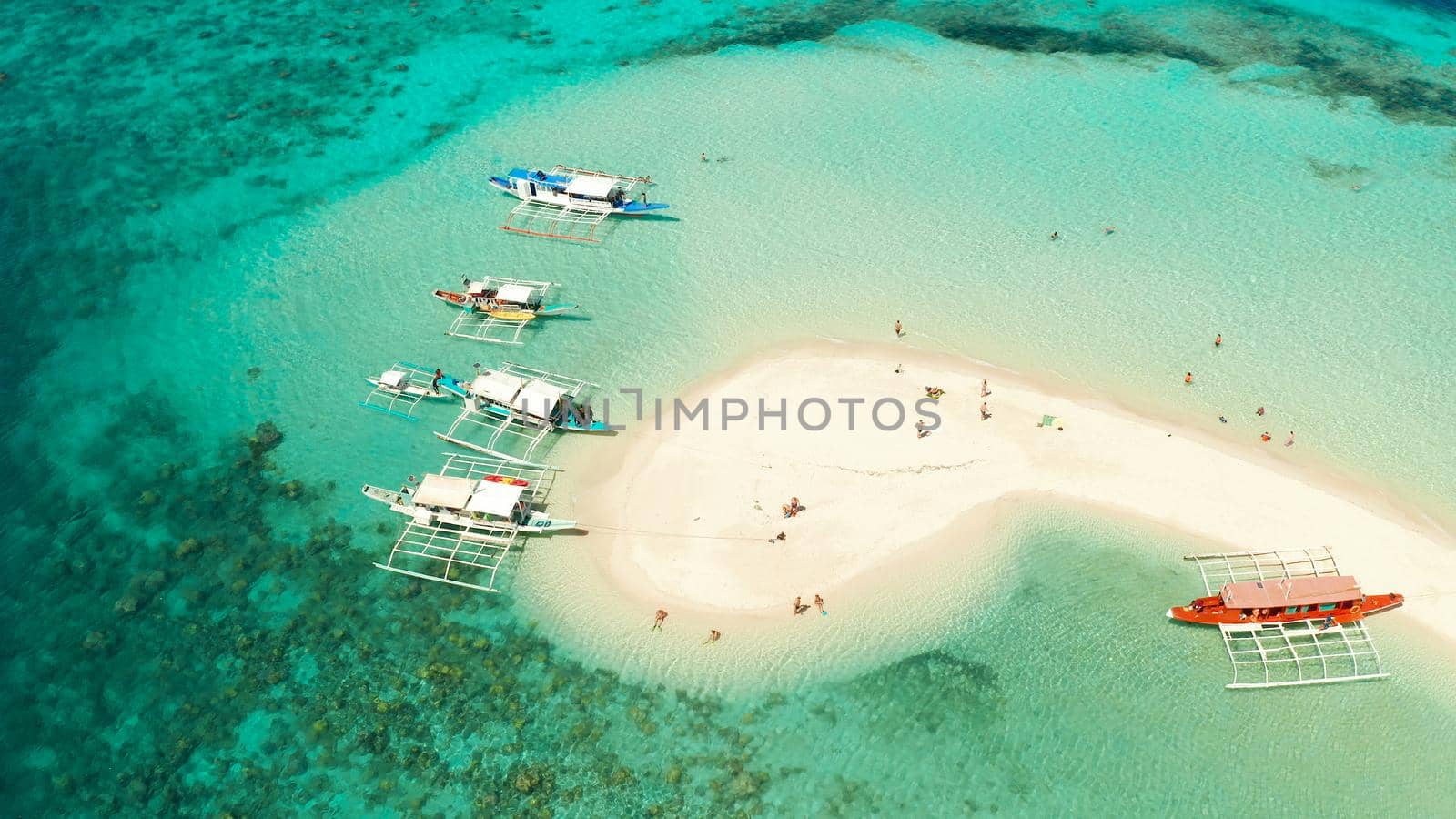 aerial seascape tropical island with sand bar, turquoise water and coral reef. Ditaytayan, Palawan, Philippines. tourist boats on tropical beach. Travel tropical concept. Palawan, Philippines