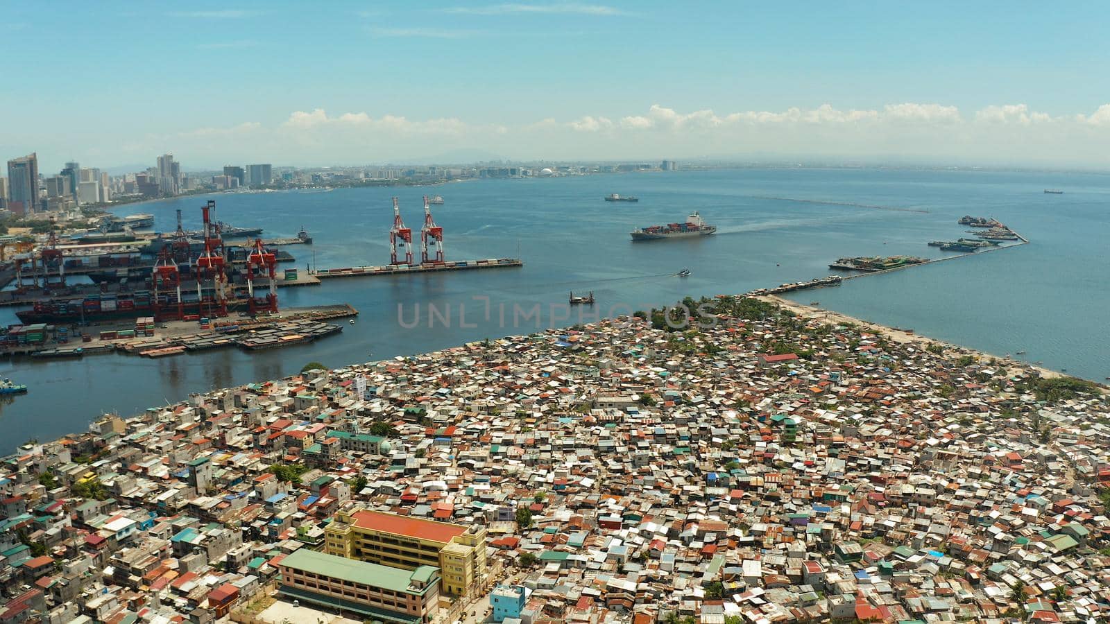 Poor district and slums with shacks in a densely populated area of Manila aerial view.