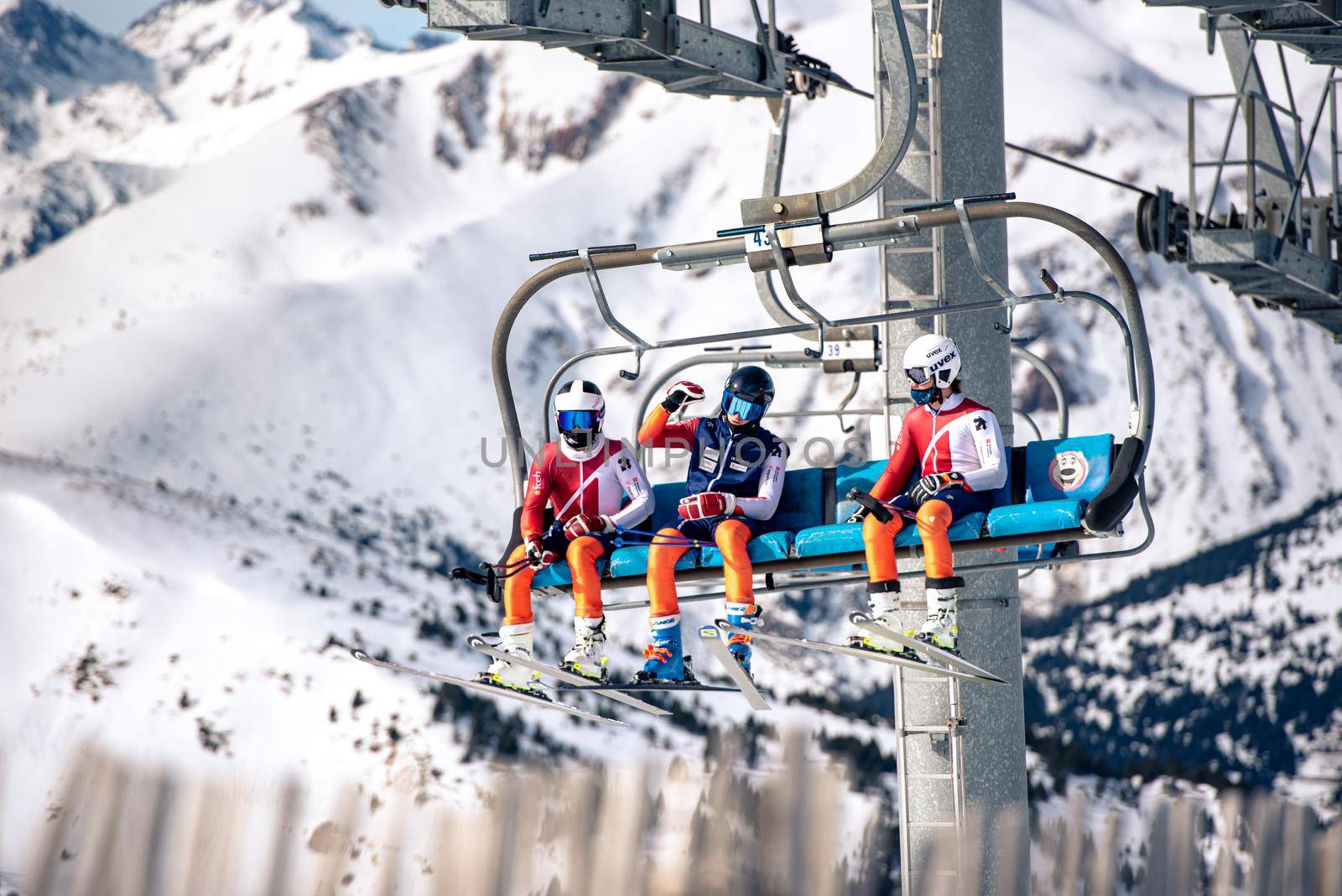 El Tarter, Andorra : 2021 Febraury 2 : Young people on the Chairlift going up to the Grandvalira ski resort in Andorra in 2021