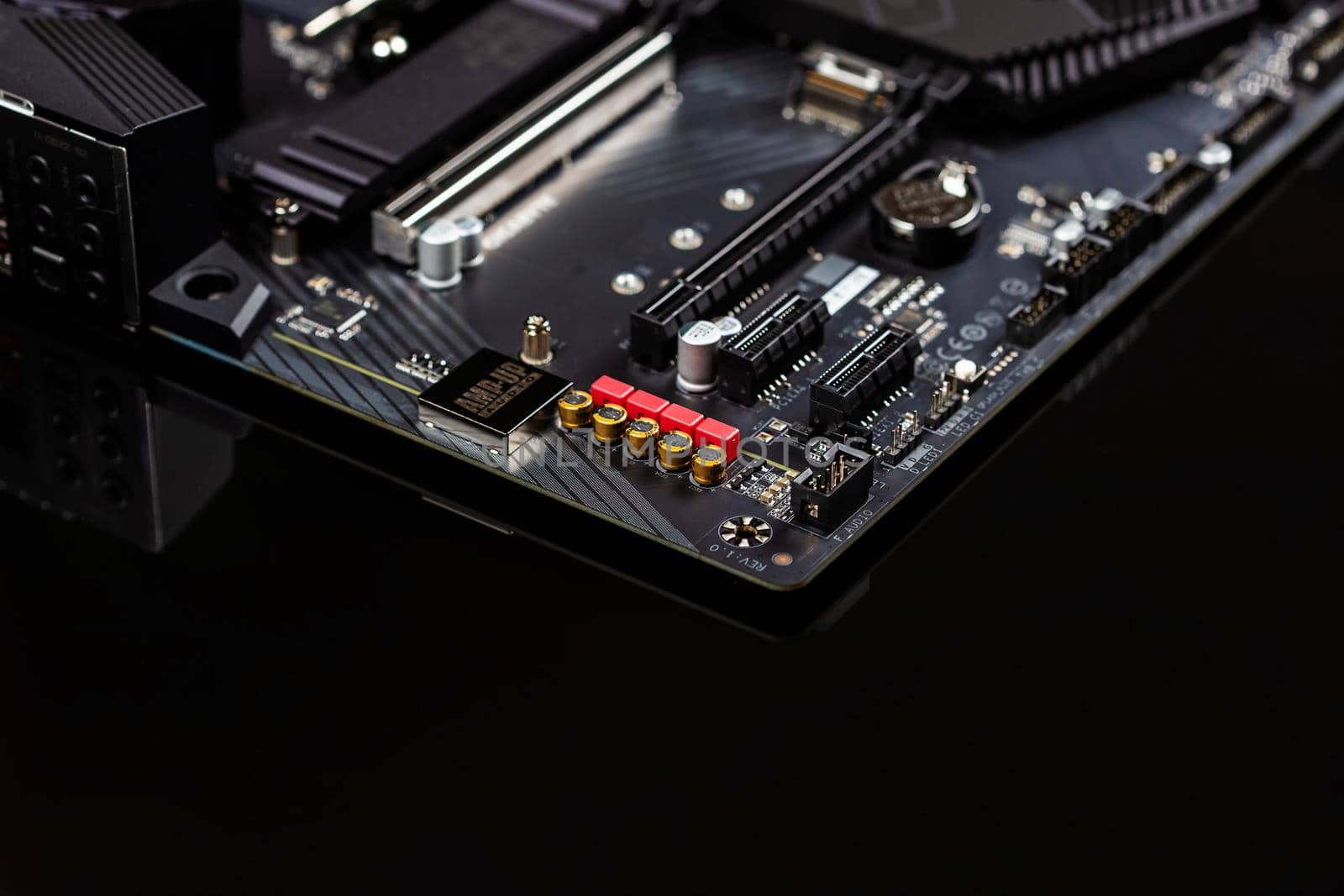 The motherboard on a table close-up, inside of a desktop computer showing chips, circuit boards and components with copy space.