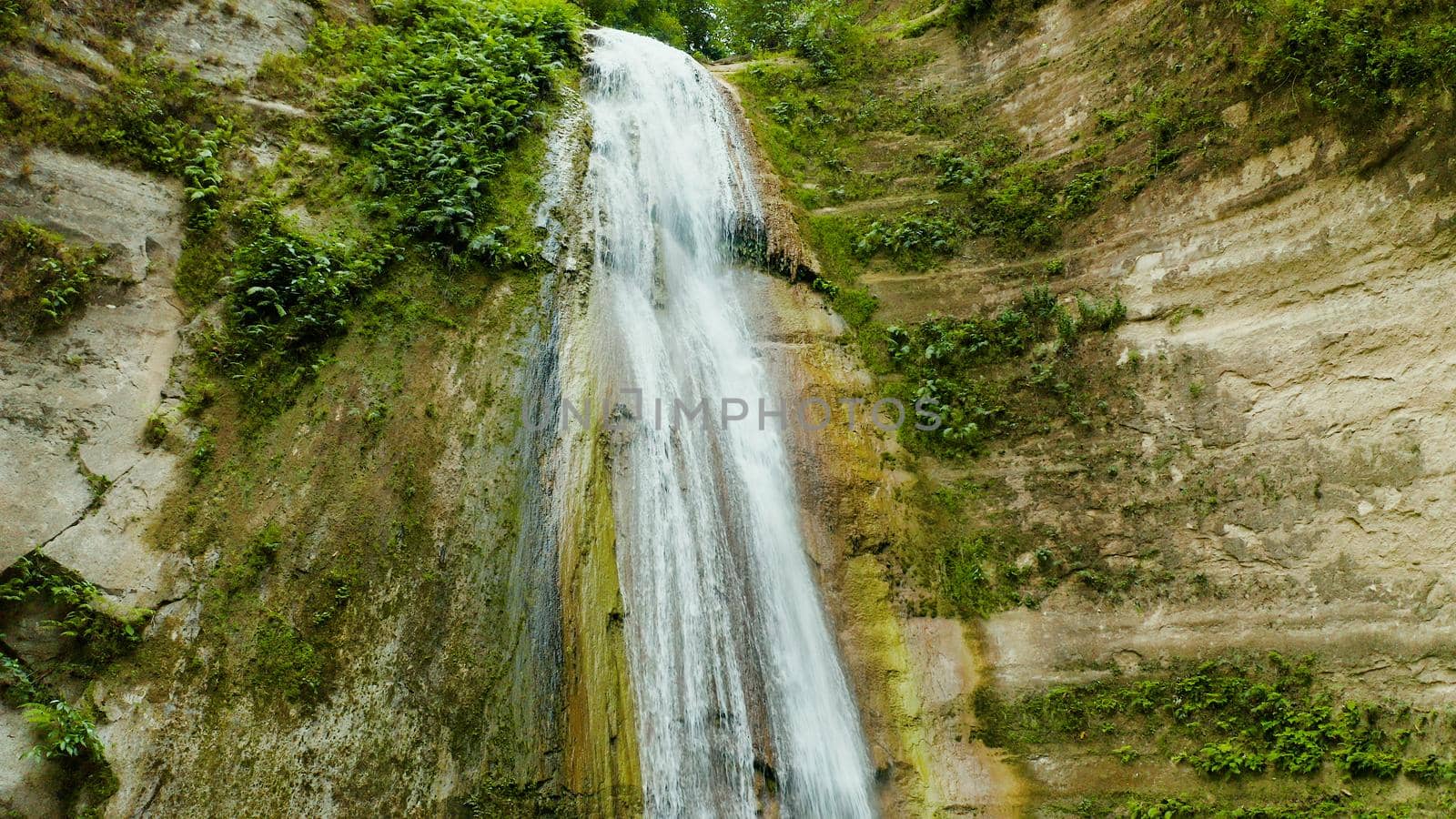 Dao waterfalls in a mountain gorge in the tropical jungle, Philippines, Cebu. Waterfall in the tropical forest.