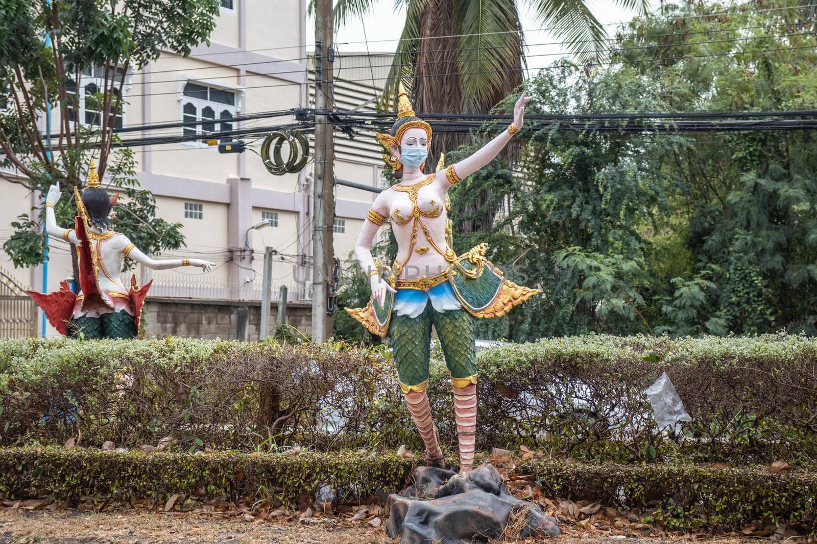 Kinnaree put a statue on the roadside to warn people to prevent the spread of COVID-19. With a protective mass