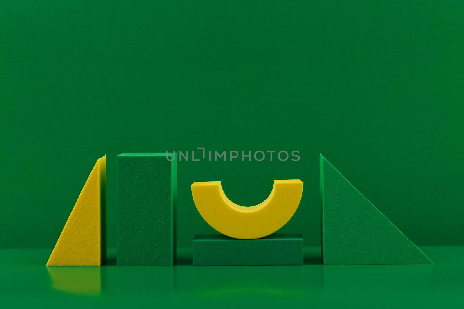 Duotone geometric composition with green and yellow figures against green background with copy space by Senorina_Irina