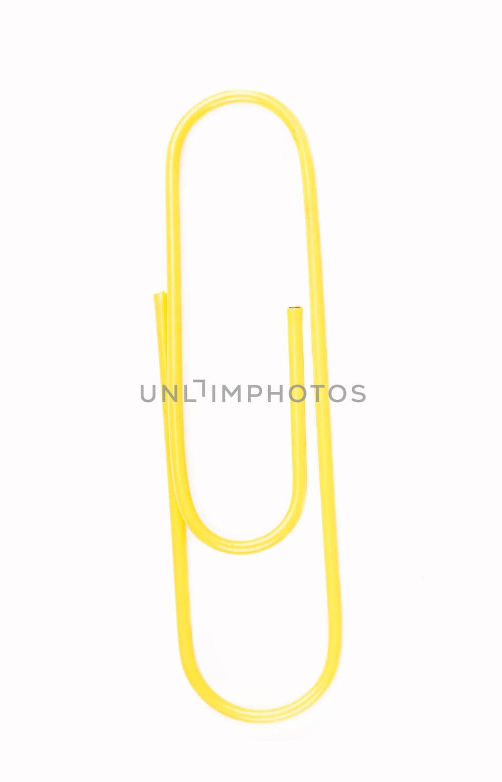 yellow paper clip on a white background