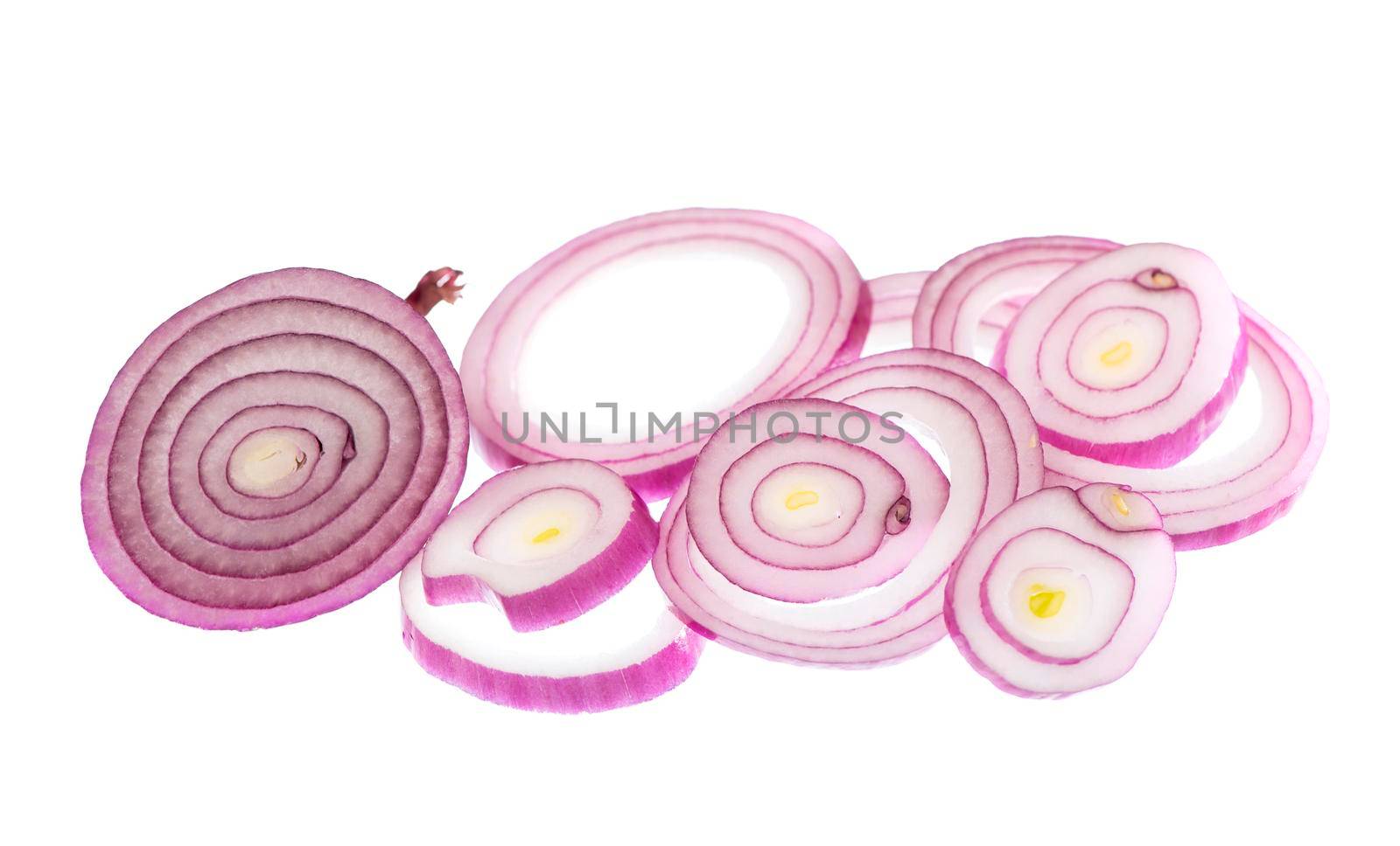 onion cut into rings drops on white background by aprilphoto