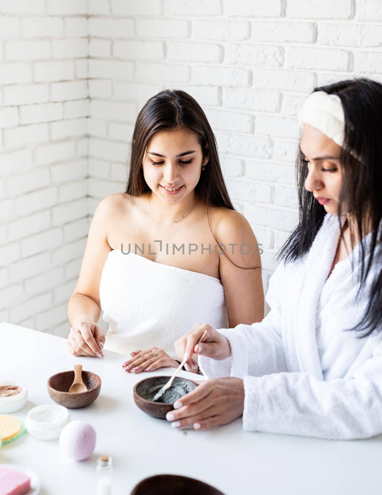 Spa and wellness concept. Self care. Women hands making facial mask doing spa procedures