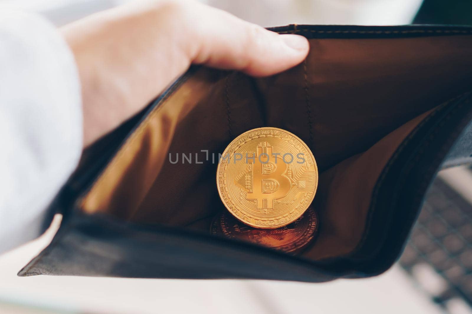 Bitcoin coin symbol of cryptocurrency digital money. Money for the future in leather wallet. Store of value or saving money in bitcoin.