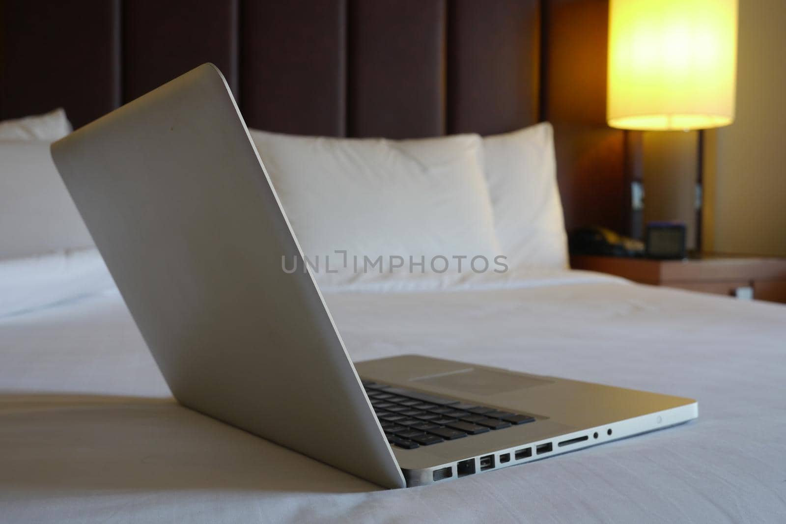 Luxury hotel bedroom with white linen