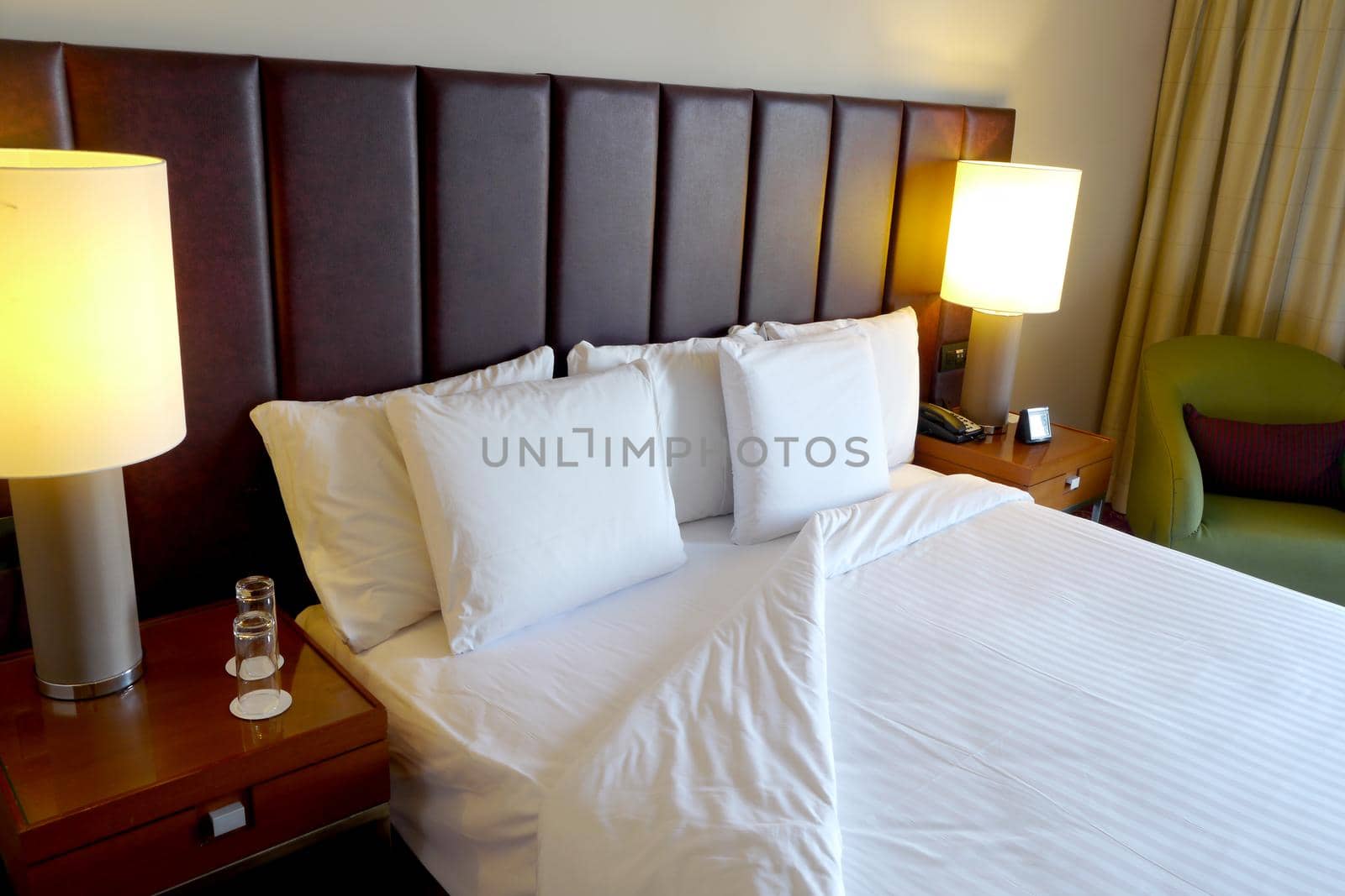 Luxury hotel bedroom with white linen