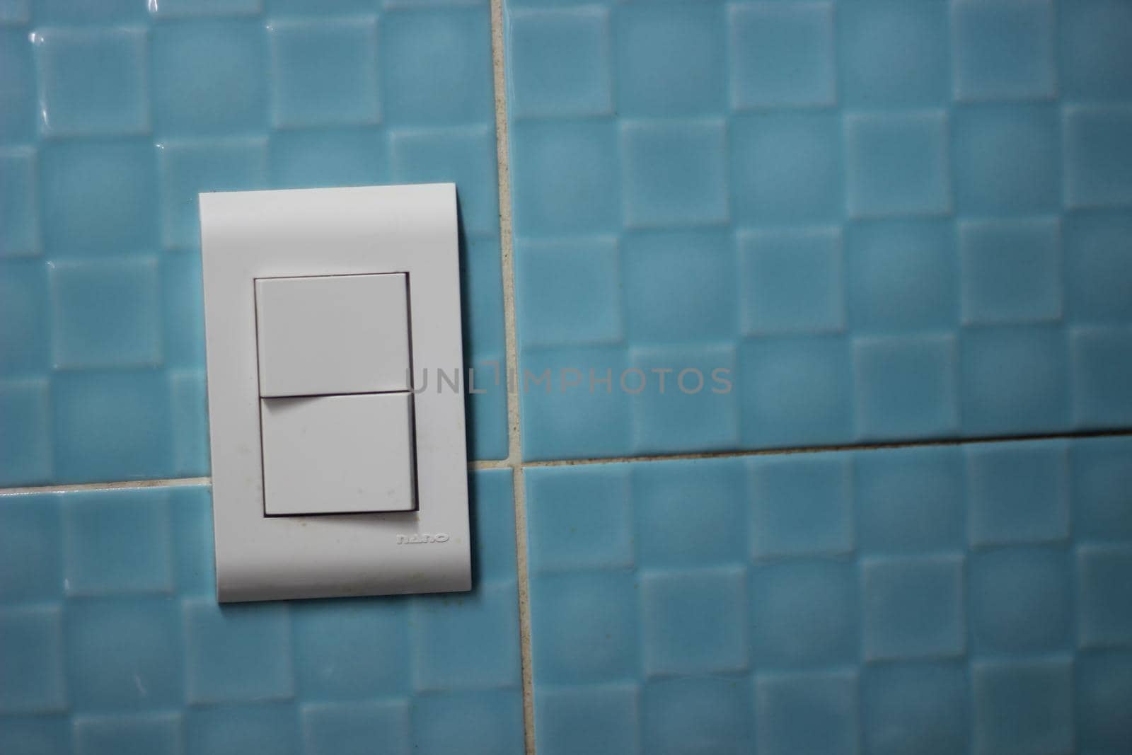 Large size ON OFF light switch button on the wall with copy space by Photochowk