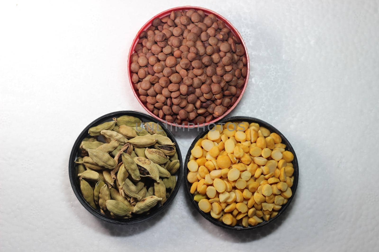 Top view of assortment of cereals, and cardamom. Collection of different spices and cereals.