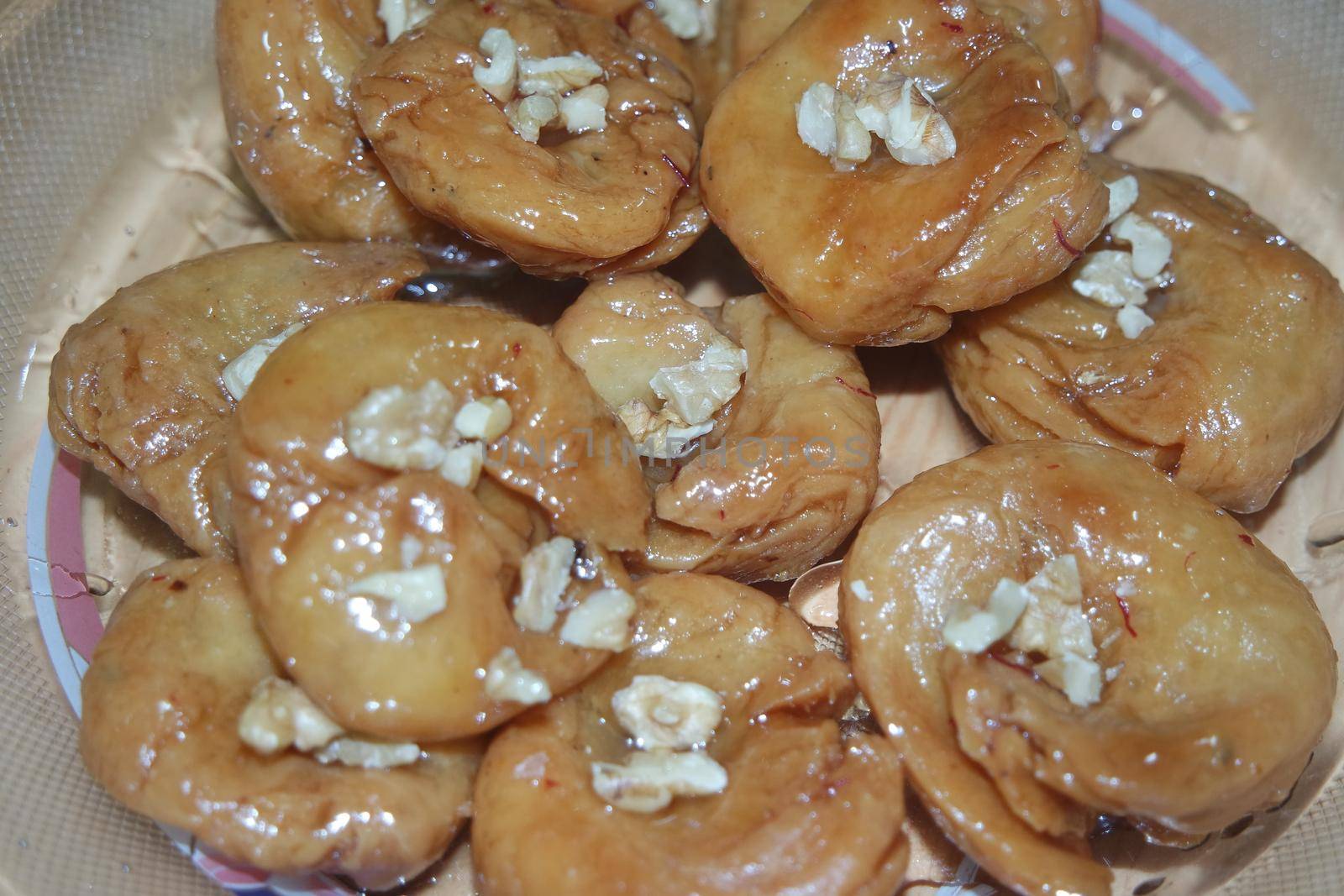 Closeup of delicious and tasty Asian sweet dish called balu shahi or baloshahi. by Photochowk