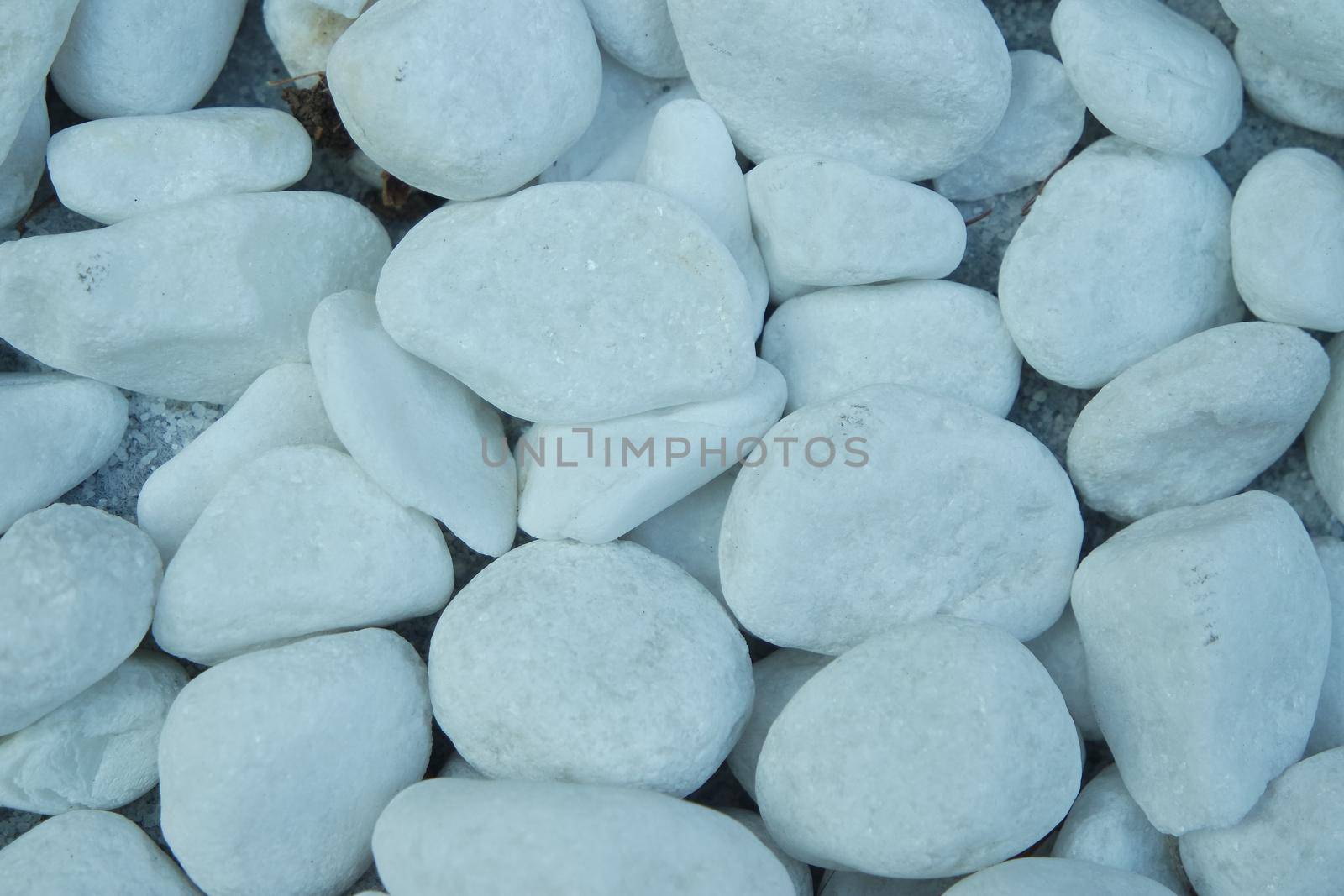 Top view of white stones background by Photochowk