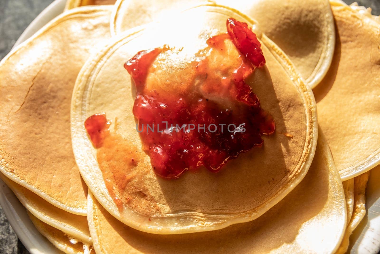 delicious pancakes with strawberry jam