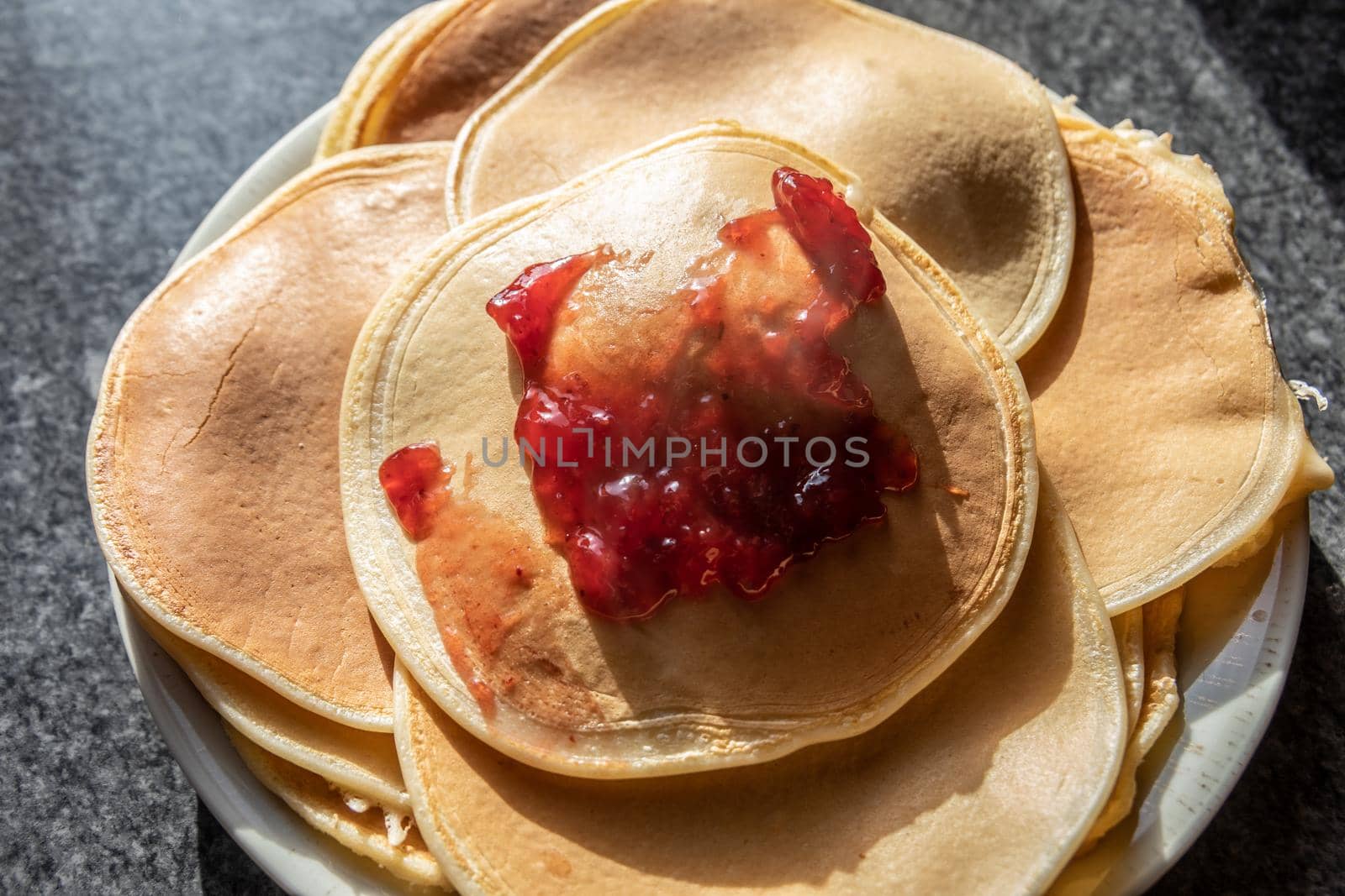 delicious pancakes with strawberry jam