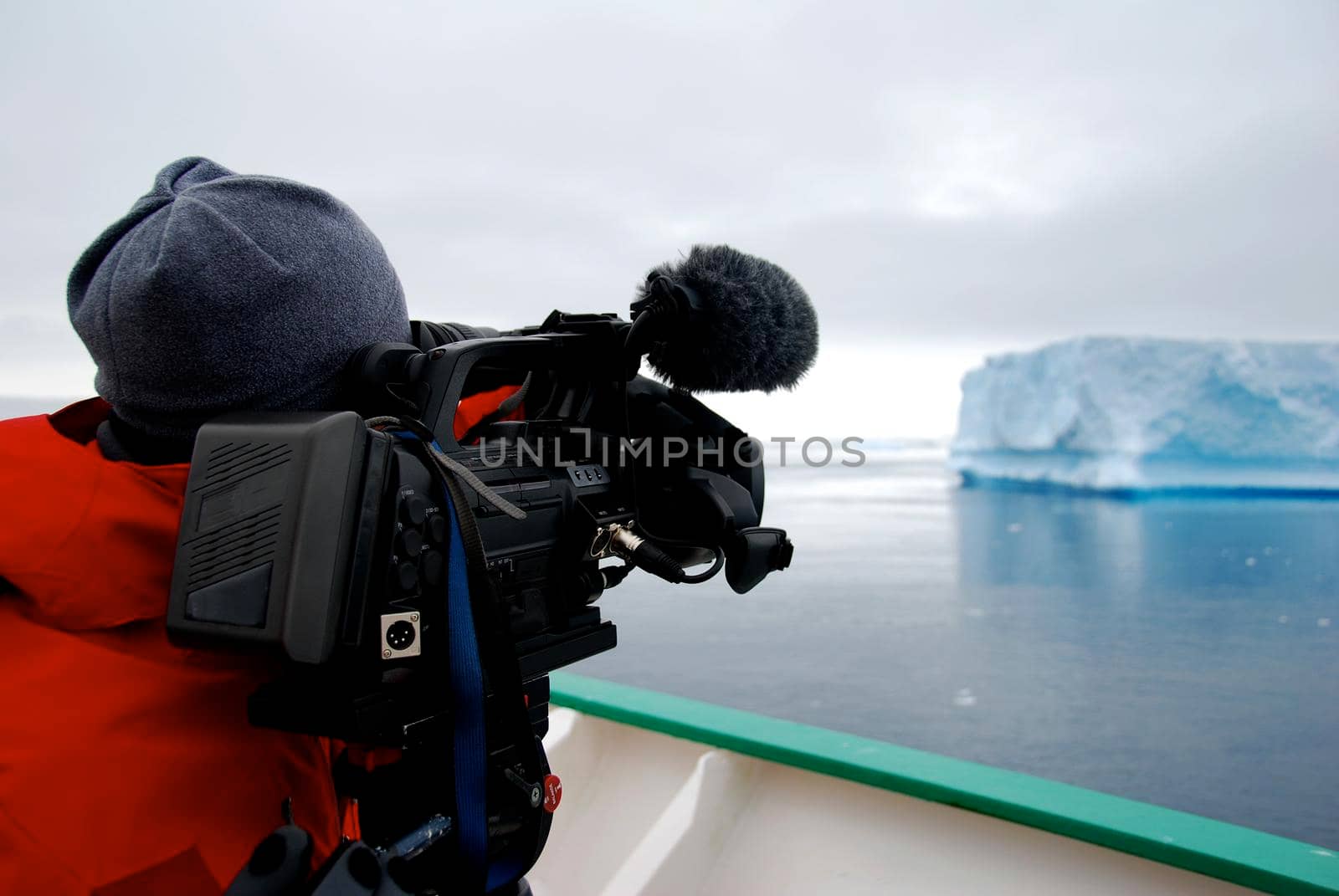 Cameraman filming an iceberg in Antarctica by fivepointsix