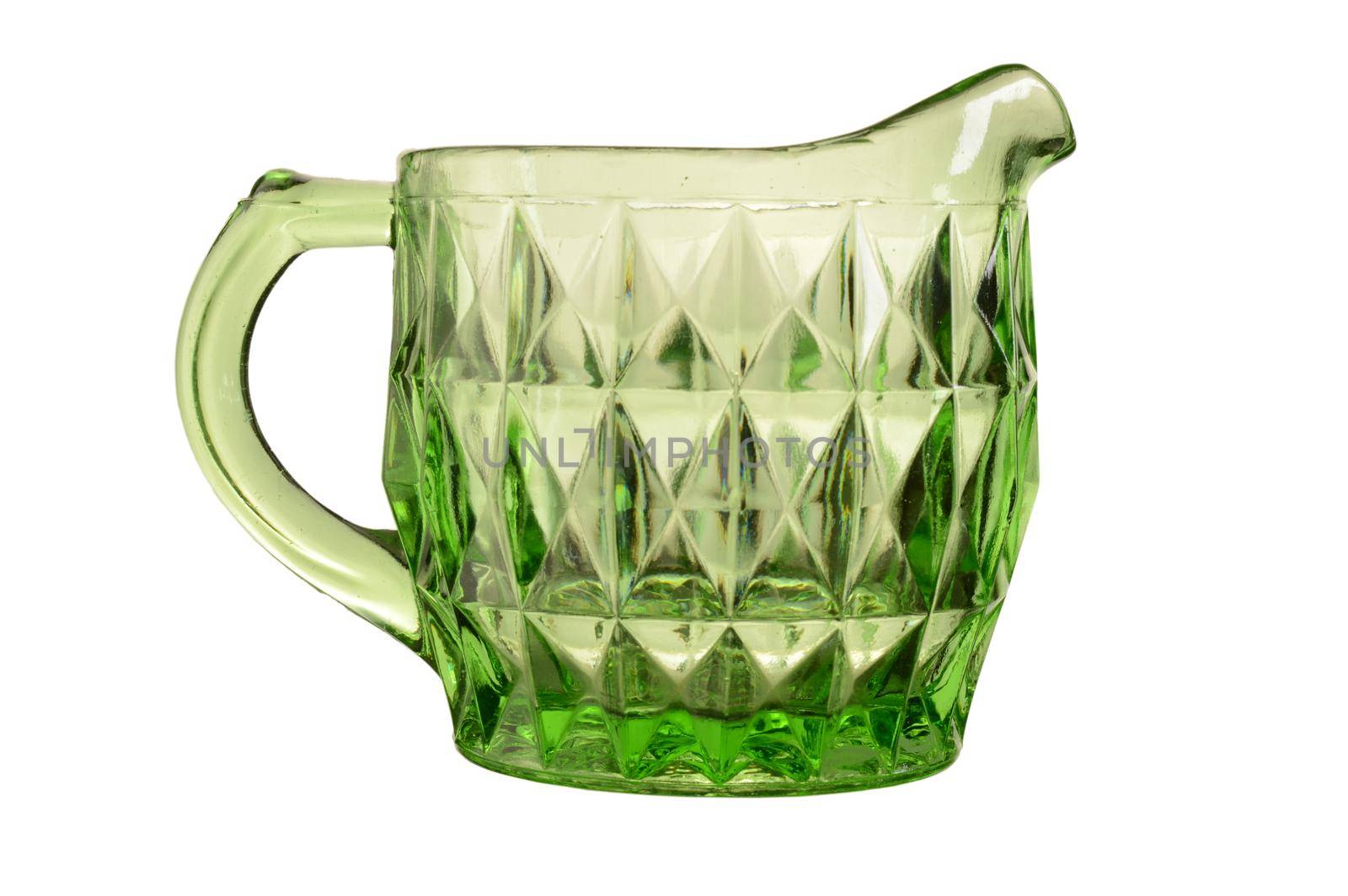 An isolated over white image of a Green Uranium Depression glass cream jug.