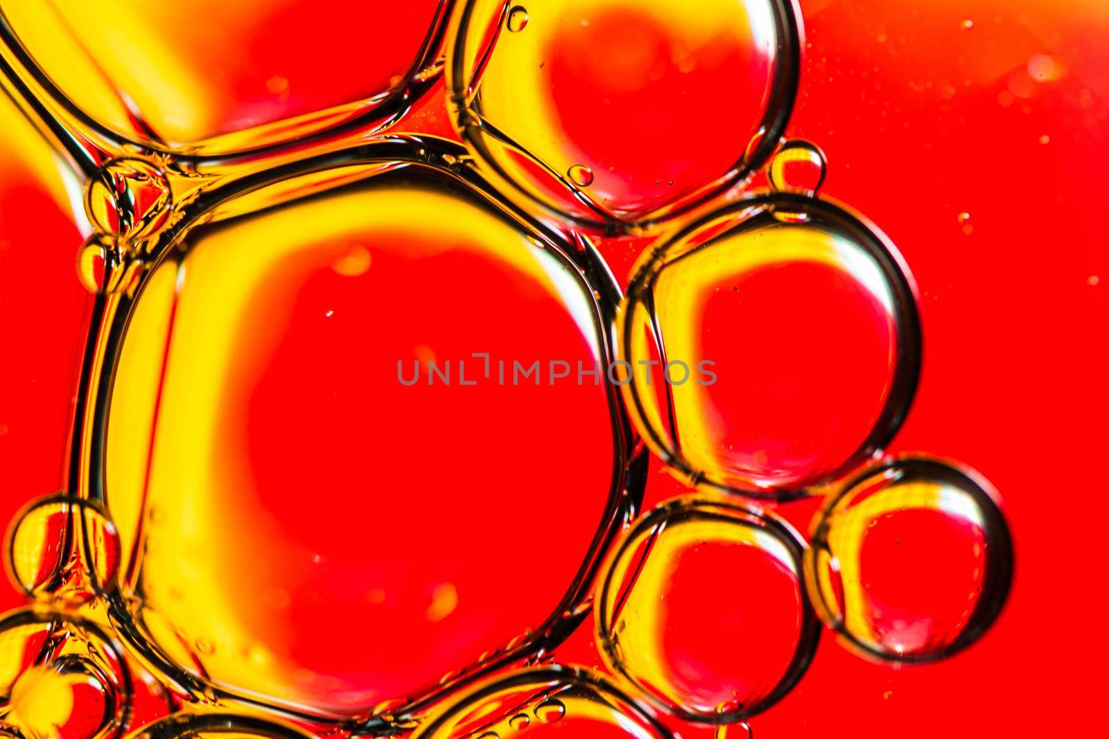 Abstract colorful backdrop with oil drops and waves on water surface. Abstract background concept