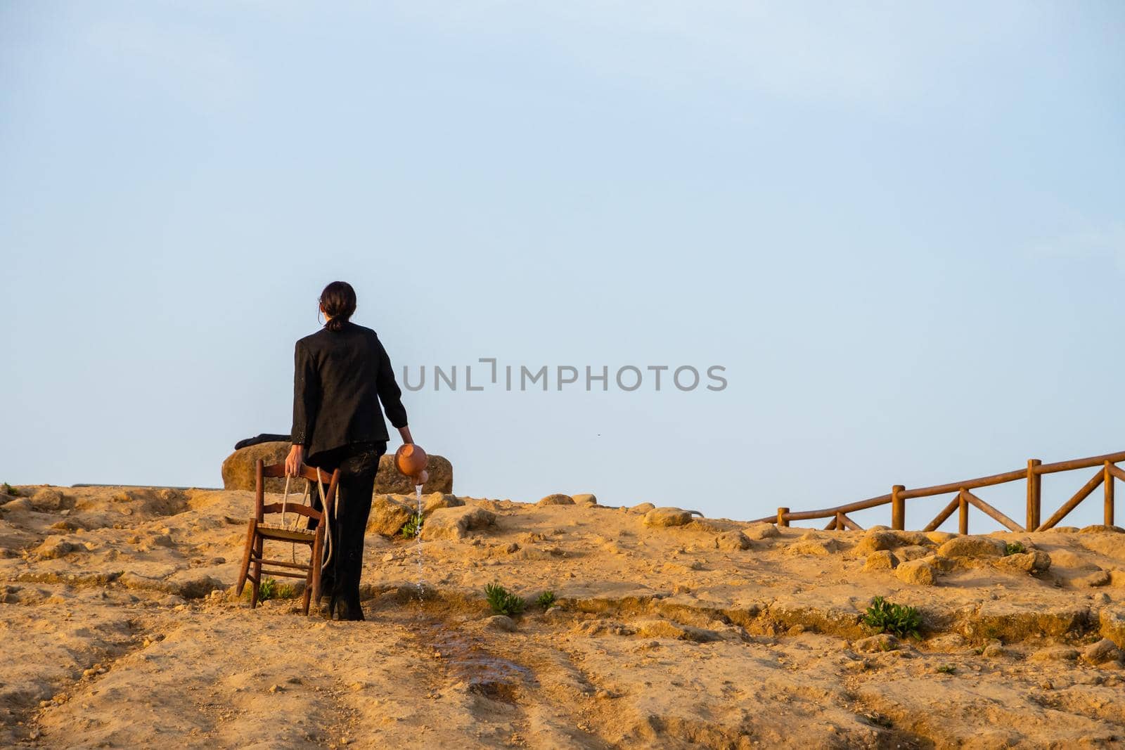 Agrigento, Italy - 14 8 2020: Artists performance at dusk at Concordia Temple by mauricallari