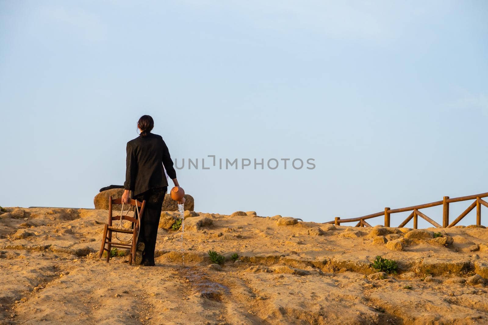 Agrigento, Italy - 14 8 2020: Artists performance at dusk at Concordia Temple by mauricallari