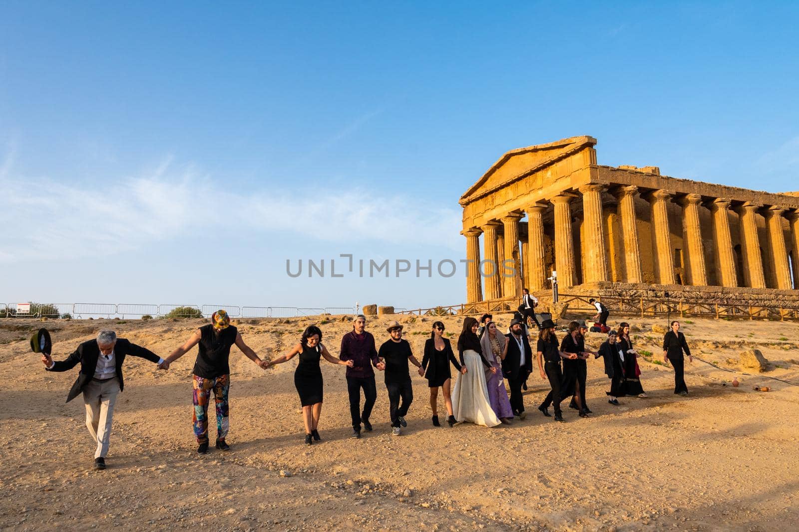 Artists perform after dusk at Concordia Temple in a summer sunny morning