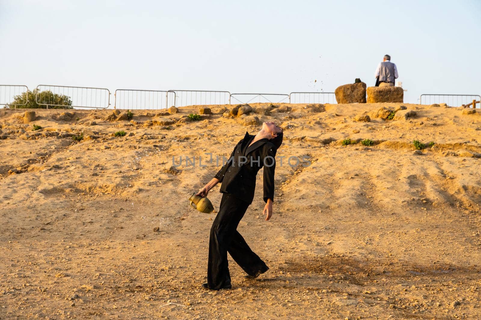 Agrigento, Italy - 14 8 2020: Artists performance at dusk at Concordia Temple by mauricallari