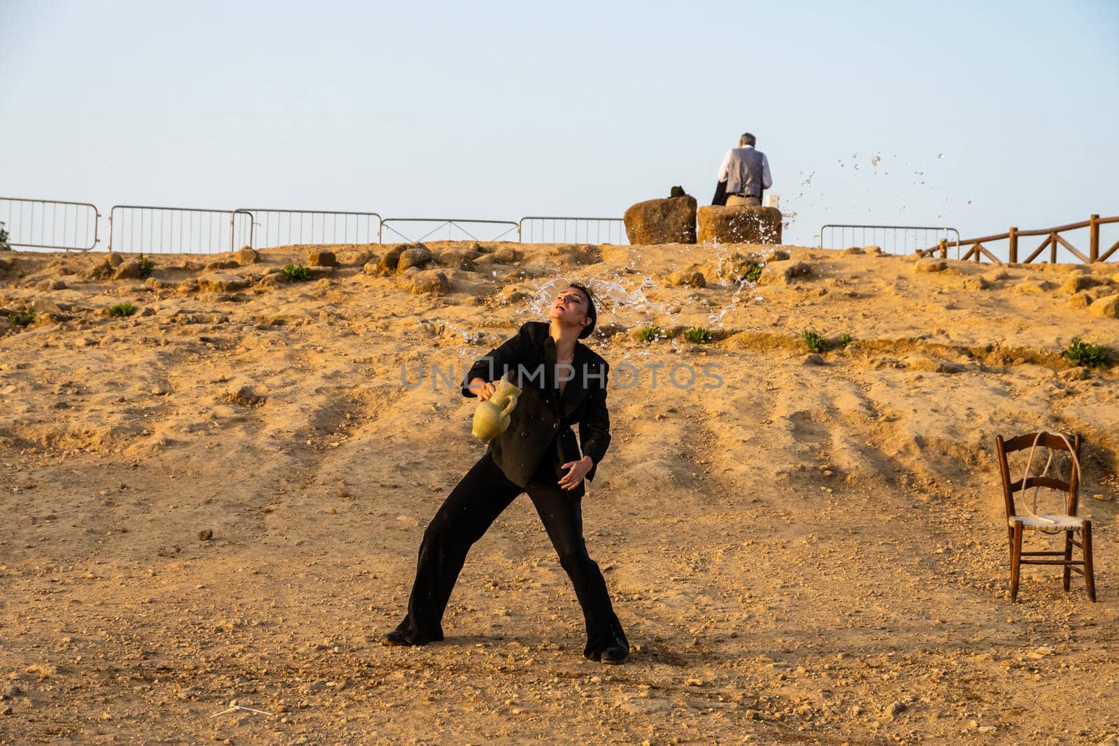 Agrigento, Italy - 14 8 2020: Artists performance at dusk at Concordia Temple by mauricallari