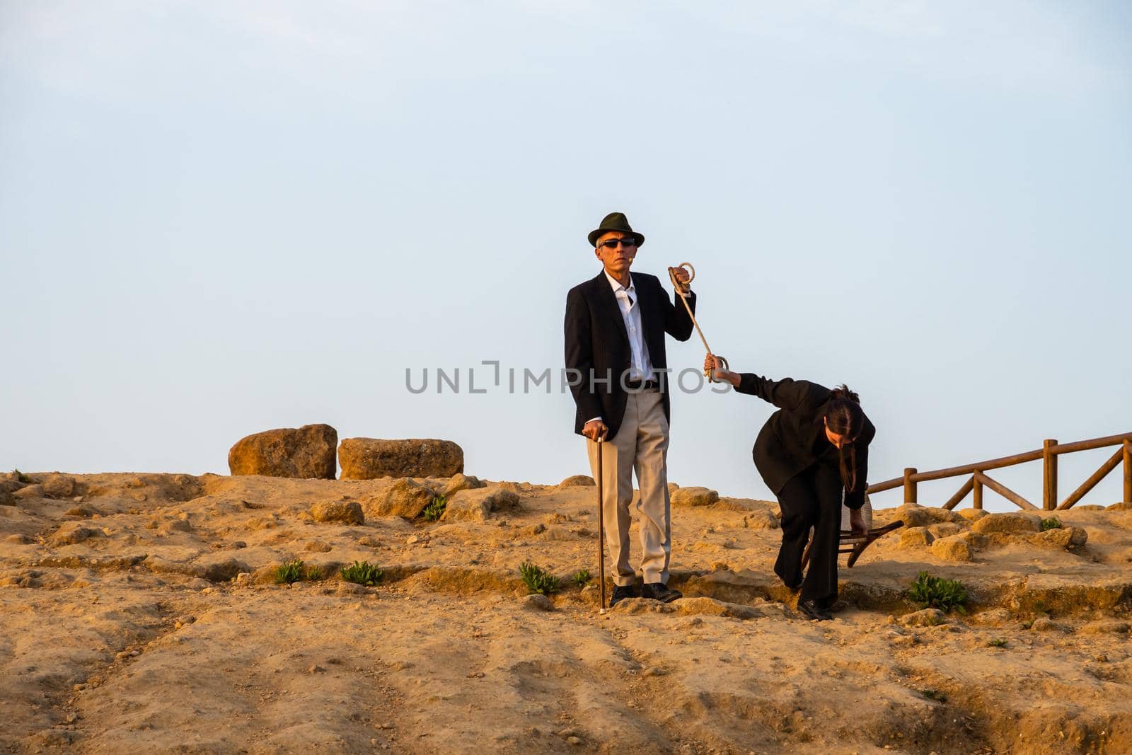 Agrigento, Italy - 14 8 2020: Artists performance at dusk at Concordia Temple by mauricallari