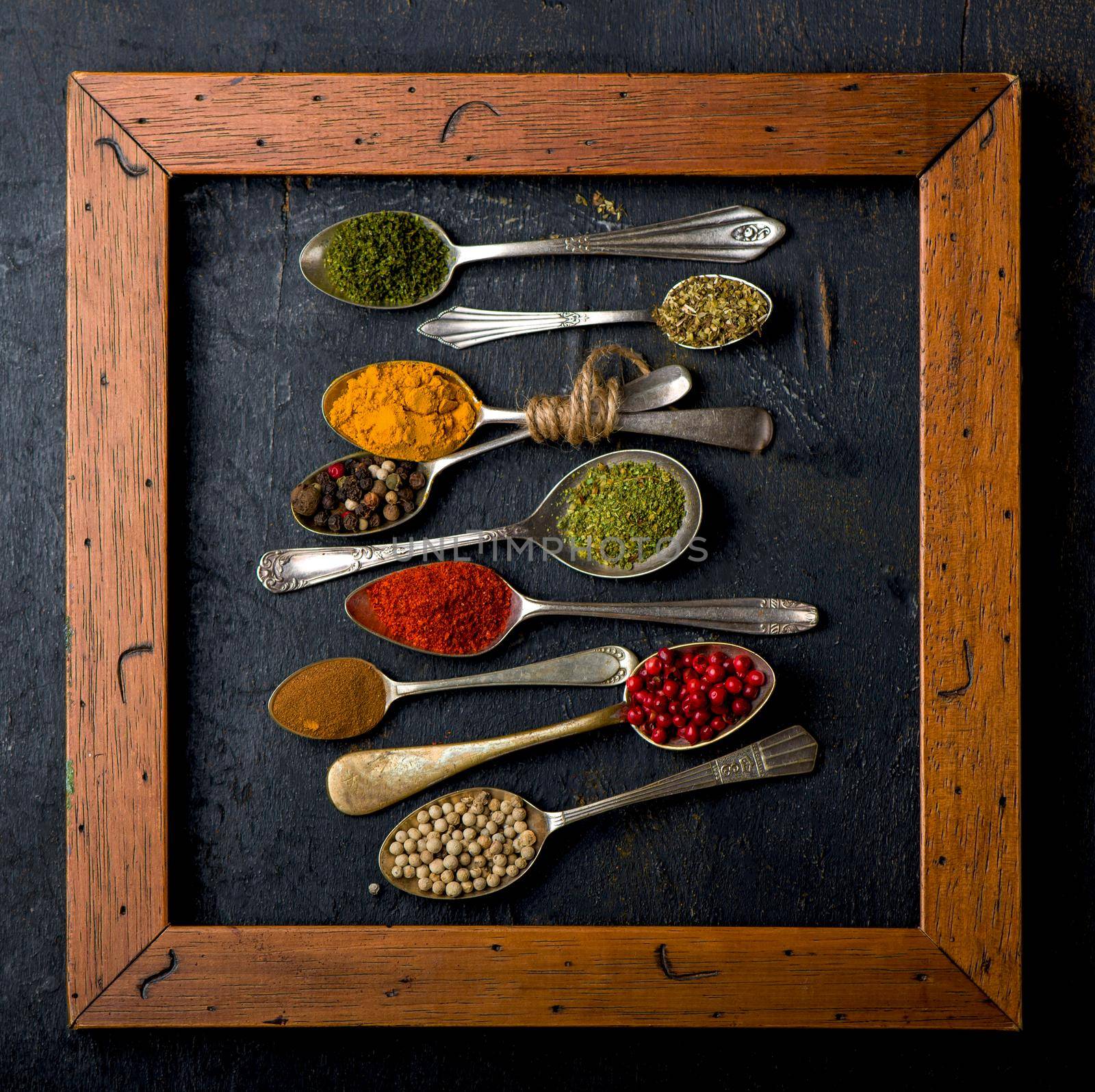 Various spices spoons on table. Top view with copy space