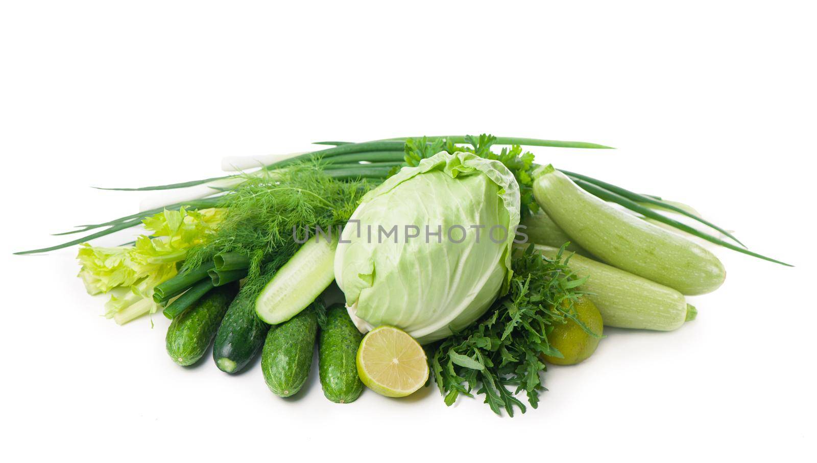 Composition with raw juicy green vegetables isolated on white by aprilphoto