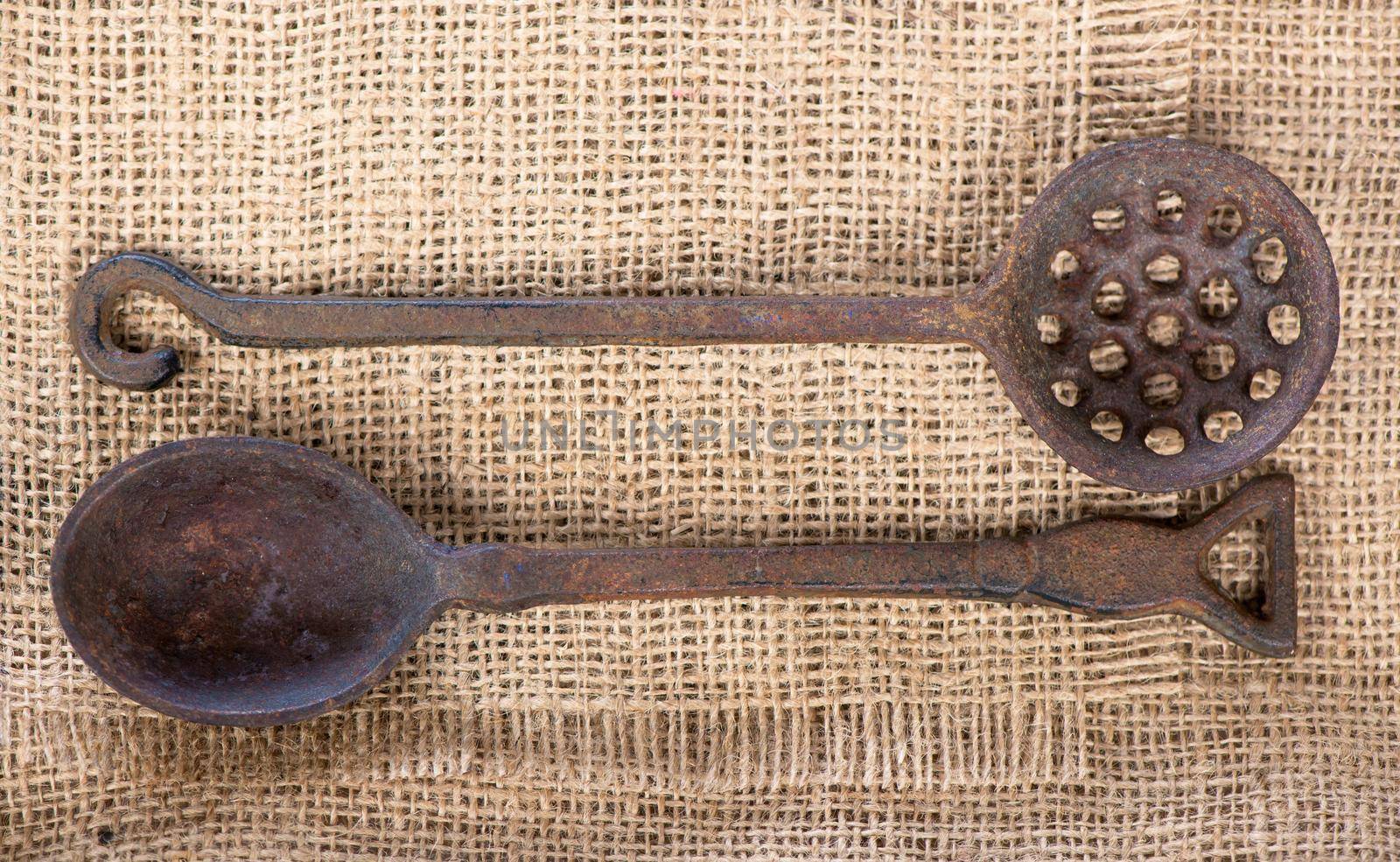 Old vintage kitchen utensils on sackcloth. Top view with copy space by aprilphoto