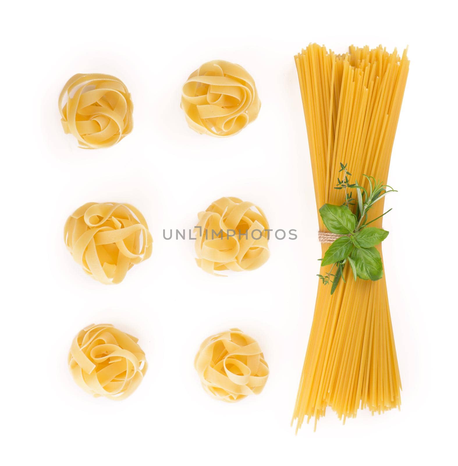 Spaghetti and basil isolated on white background. by aprilphoto