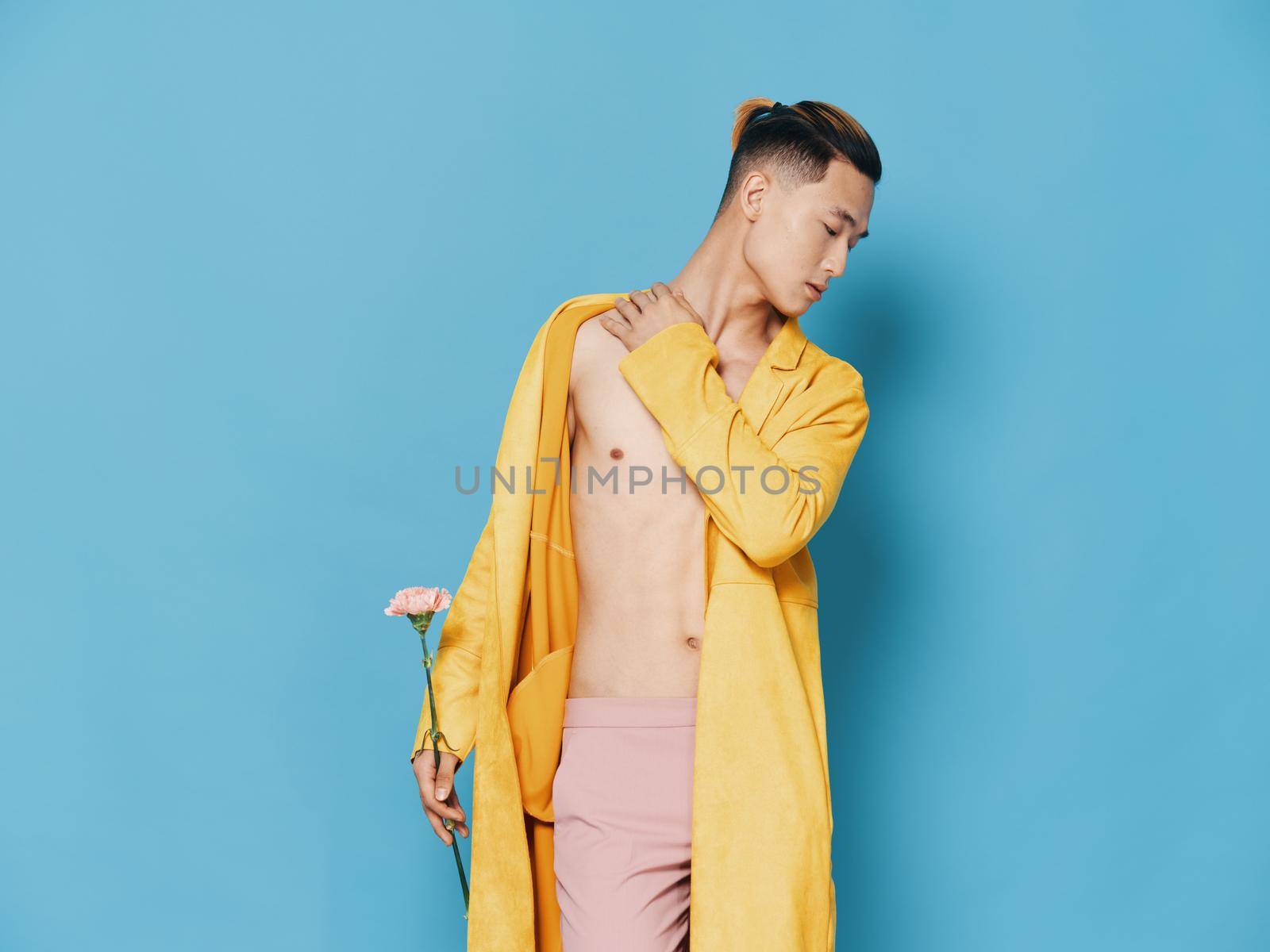 fashionable korean man in an unbuttoned coat a flower in his hand and a haircut on his head by SHOTPRIME